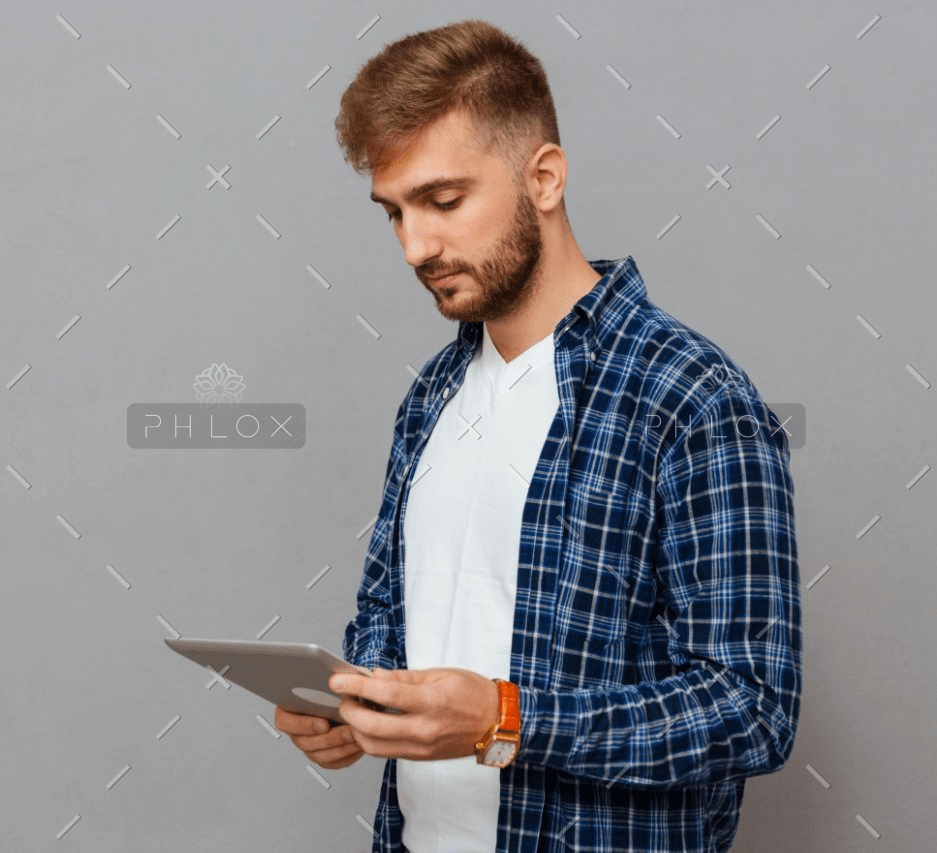 demo-attachment-16-portrait-of-a-man-using-tablet-computer-PCDLD3R